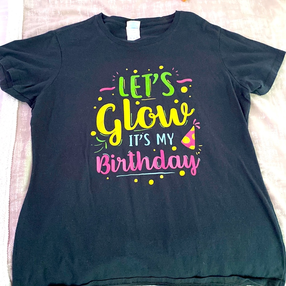 This is a black birthday shirt size medium in ladies